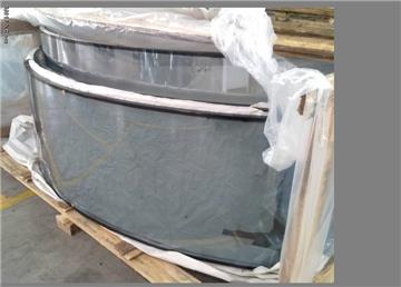 Bent tempered glass with heat soak treatment